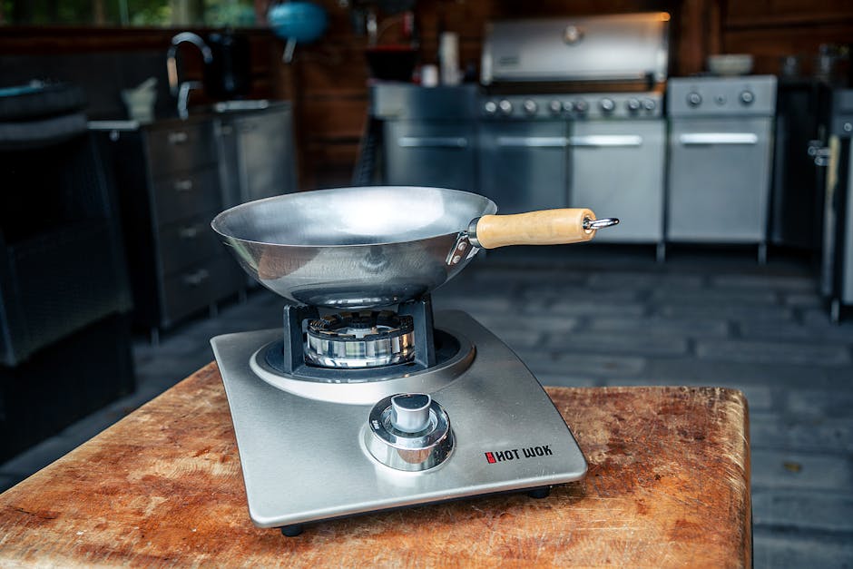 Best Wok for Electric Stove: Real Picks That Actually Work on Flat Burners Close-up of a stainless steel wok on a wooden table in a kitchen setting, perfect for culinary themes.